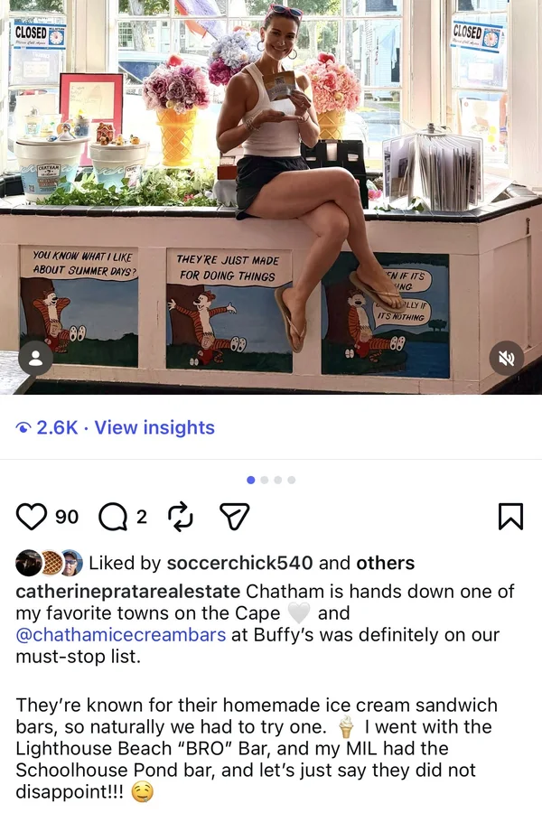 A visitor sits on the window bench at Buffy's holding a Chatham Ice Cream Bar